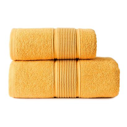 Ręcznik bawełniany NAOMI 70x140 szafranowy z bordiurą w trójwymiarowe paski