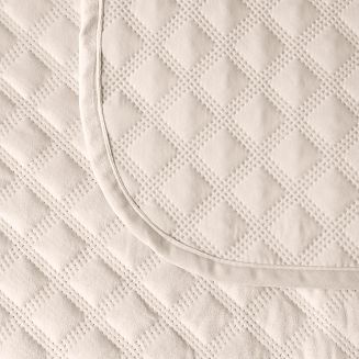 Narzuta dekoracyjna VELVI 70x160 pikowana w geometryczny wzór kremowa