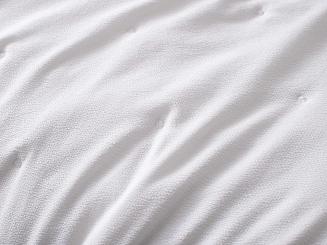 Narzuta dekoracyjna fakturowana Dotta 140x200 kremowa z haftem kropek