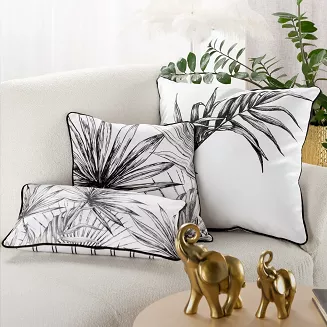 Poszewka dekoracyjna PALOMA z wypełnieniem 45x30 Eurofirany biała czarna egzotyczne liście paski