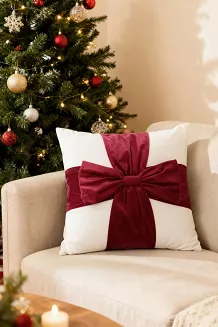 Poszewka dekoracyjna świąteczna 45x45 Christmas Bow welurowa biała z czerwoną kokardą