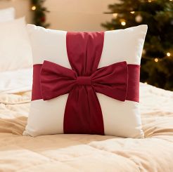 Poszewka dekoracyjna świąteczna 45x45 Christmas Bow welurowa biała z czerwoną kokardą